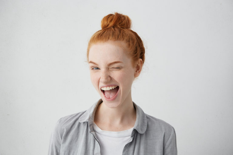 young redhead winking