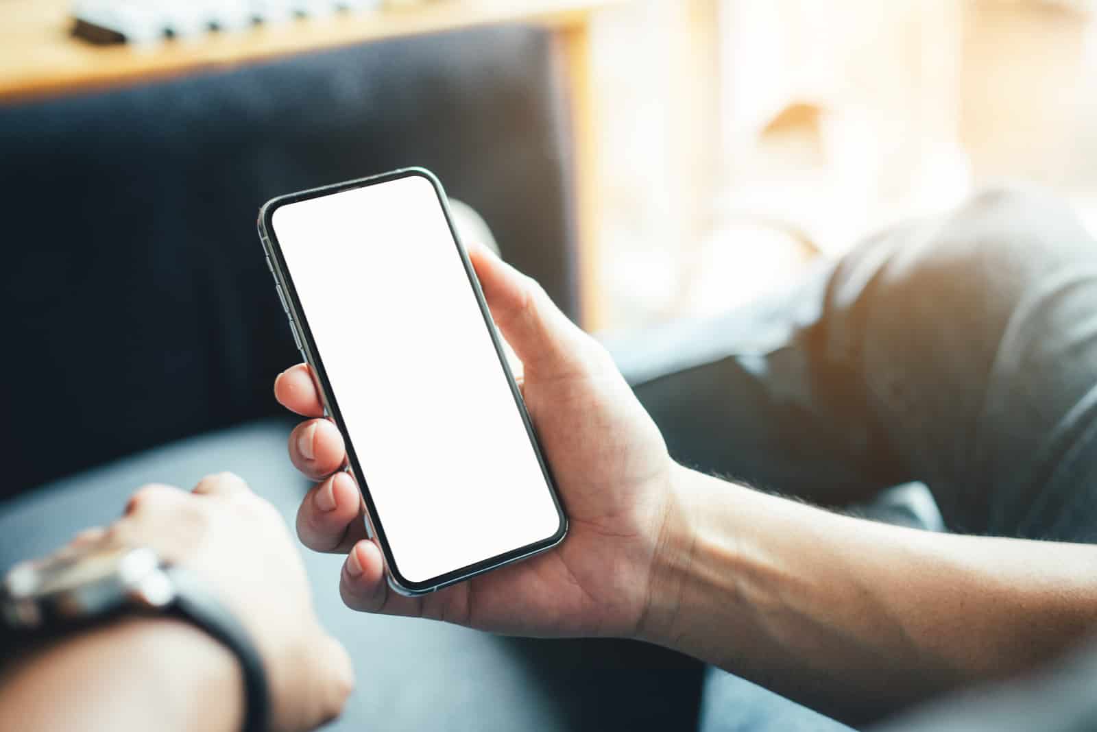 a man holding a phone in his hand