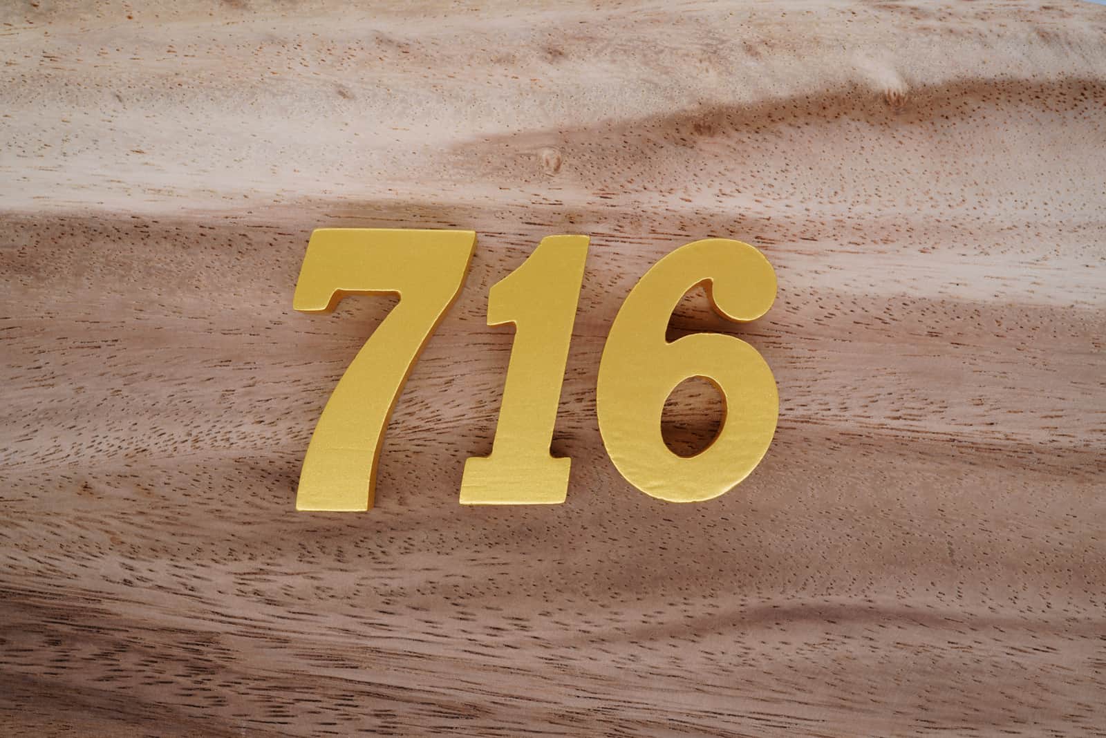 golden number 716 on table