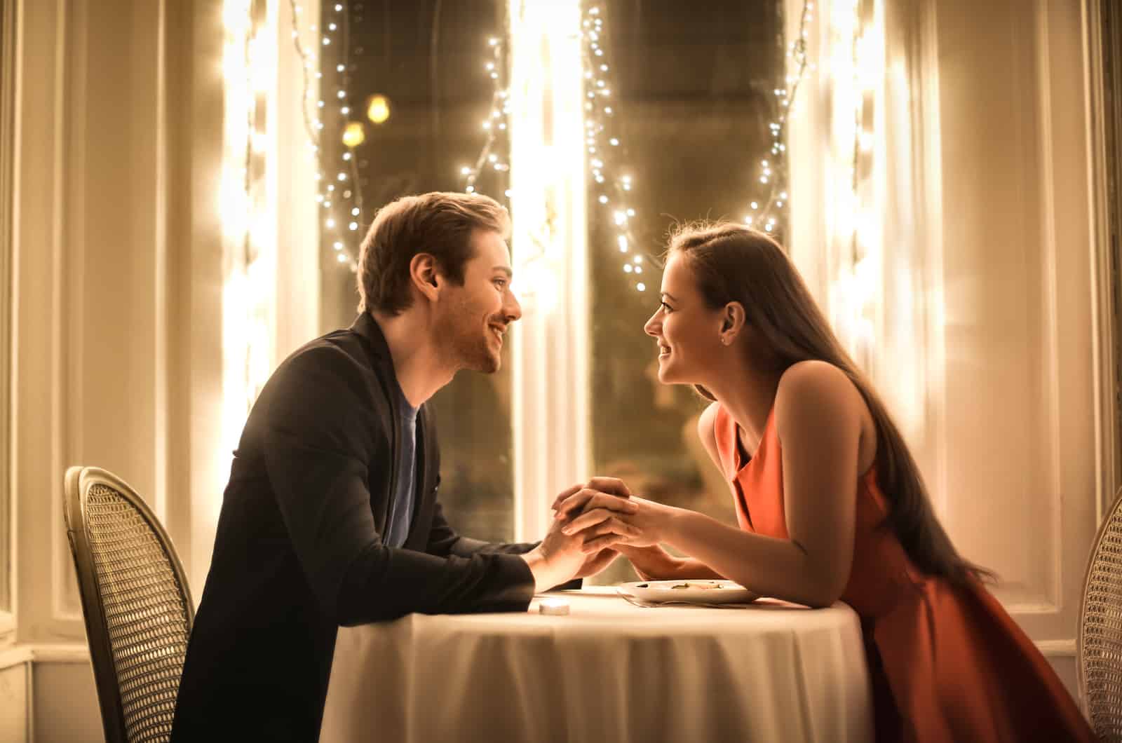 happy couple having romantic dinner