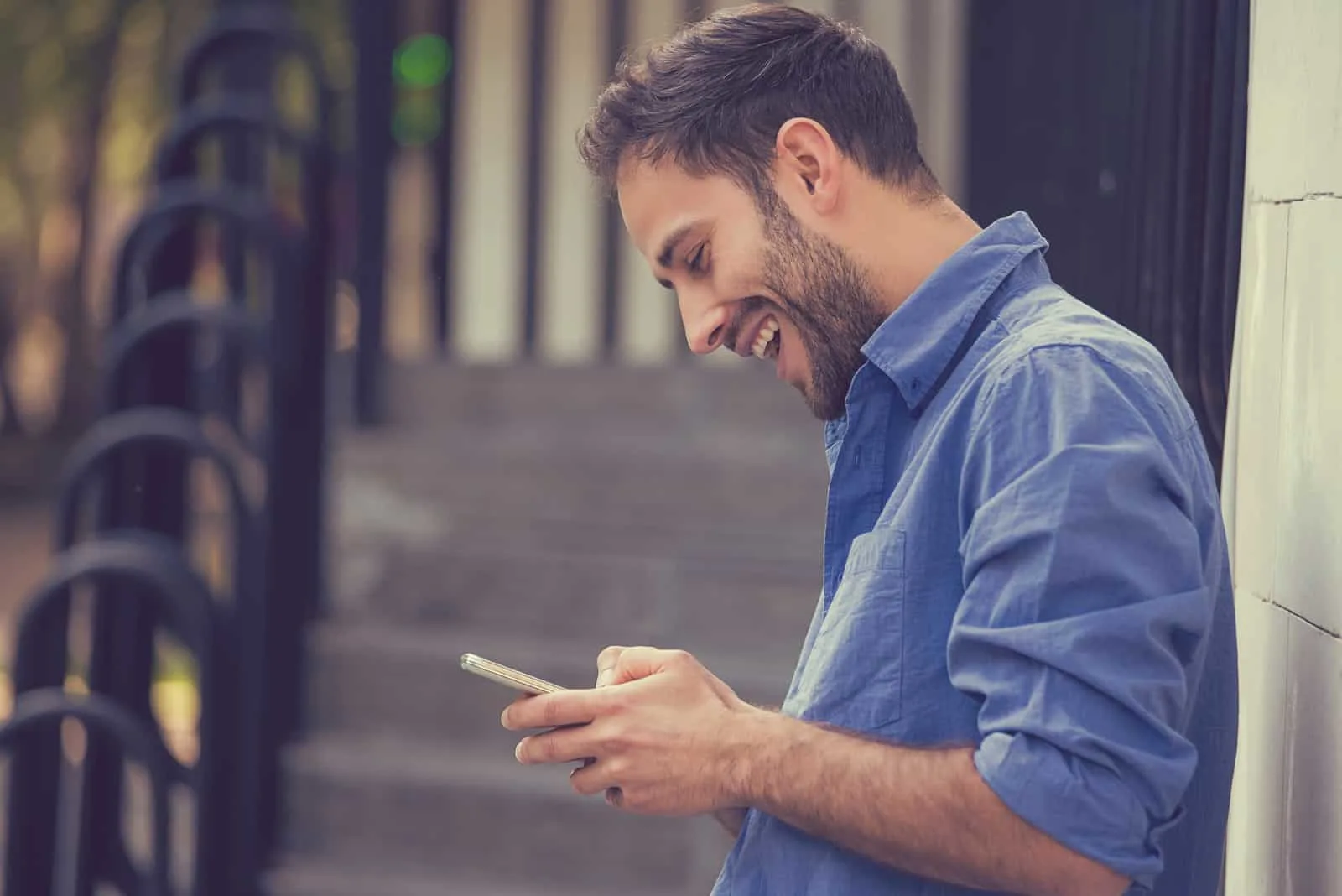 happy man texting his girlfriend