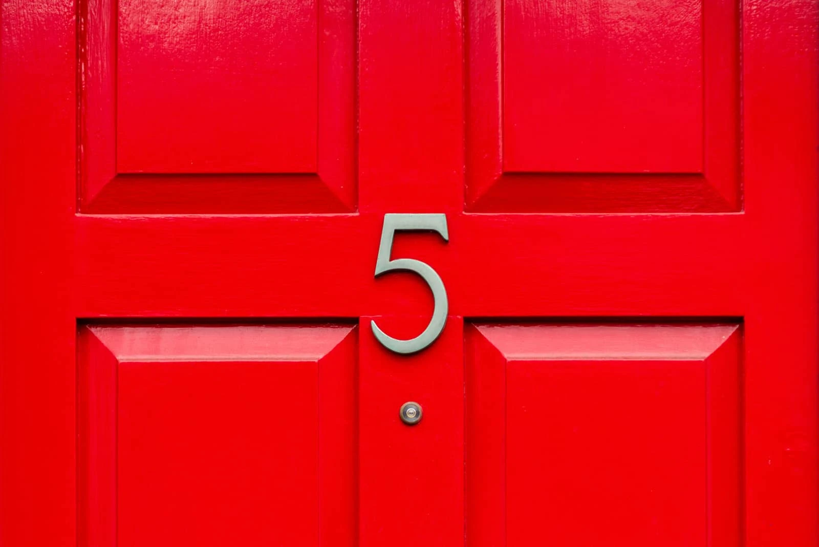 number 5 on a red wooden door