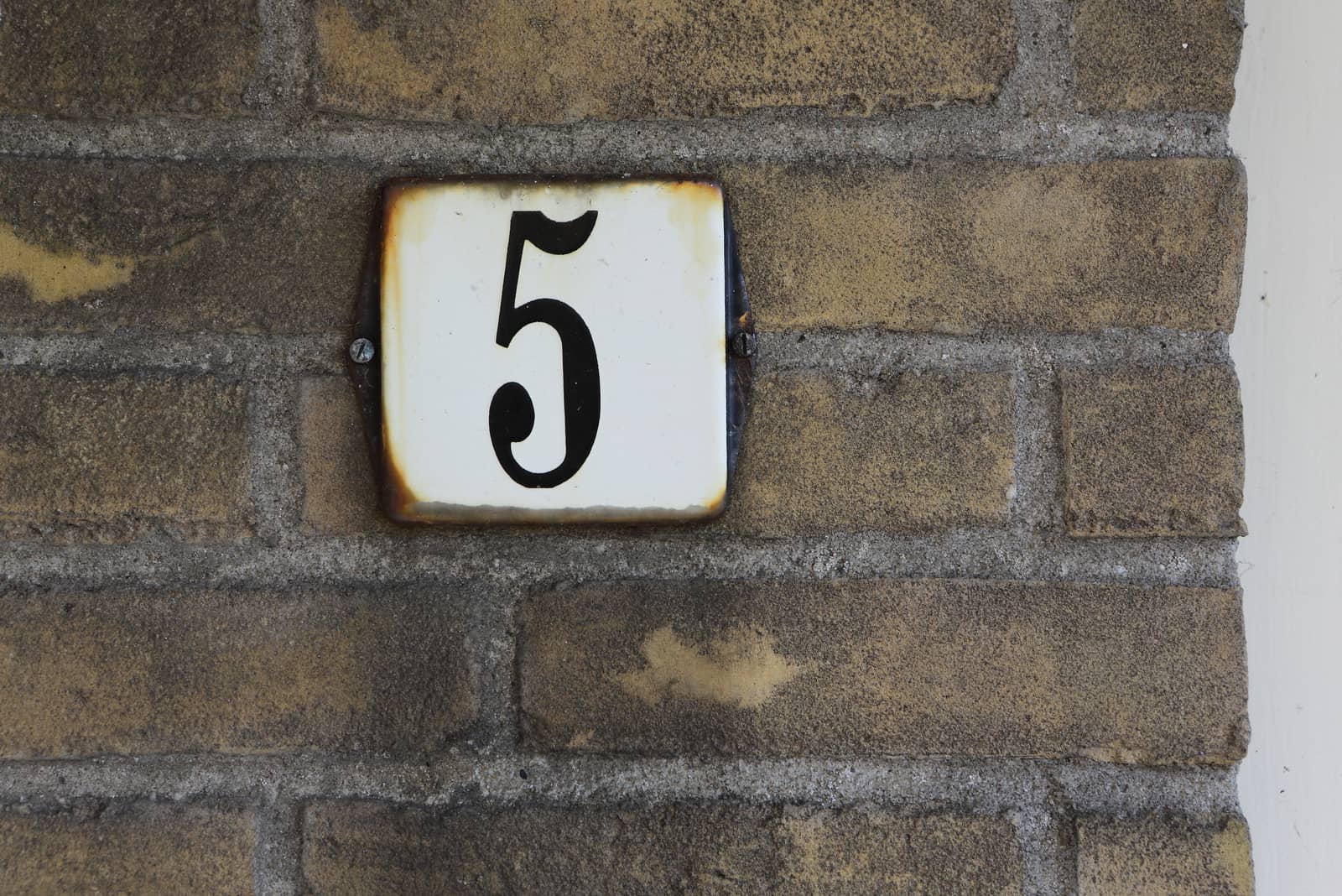 number 5 on the brick of the house
