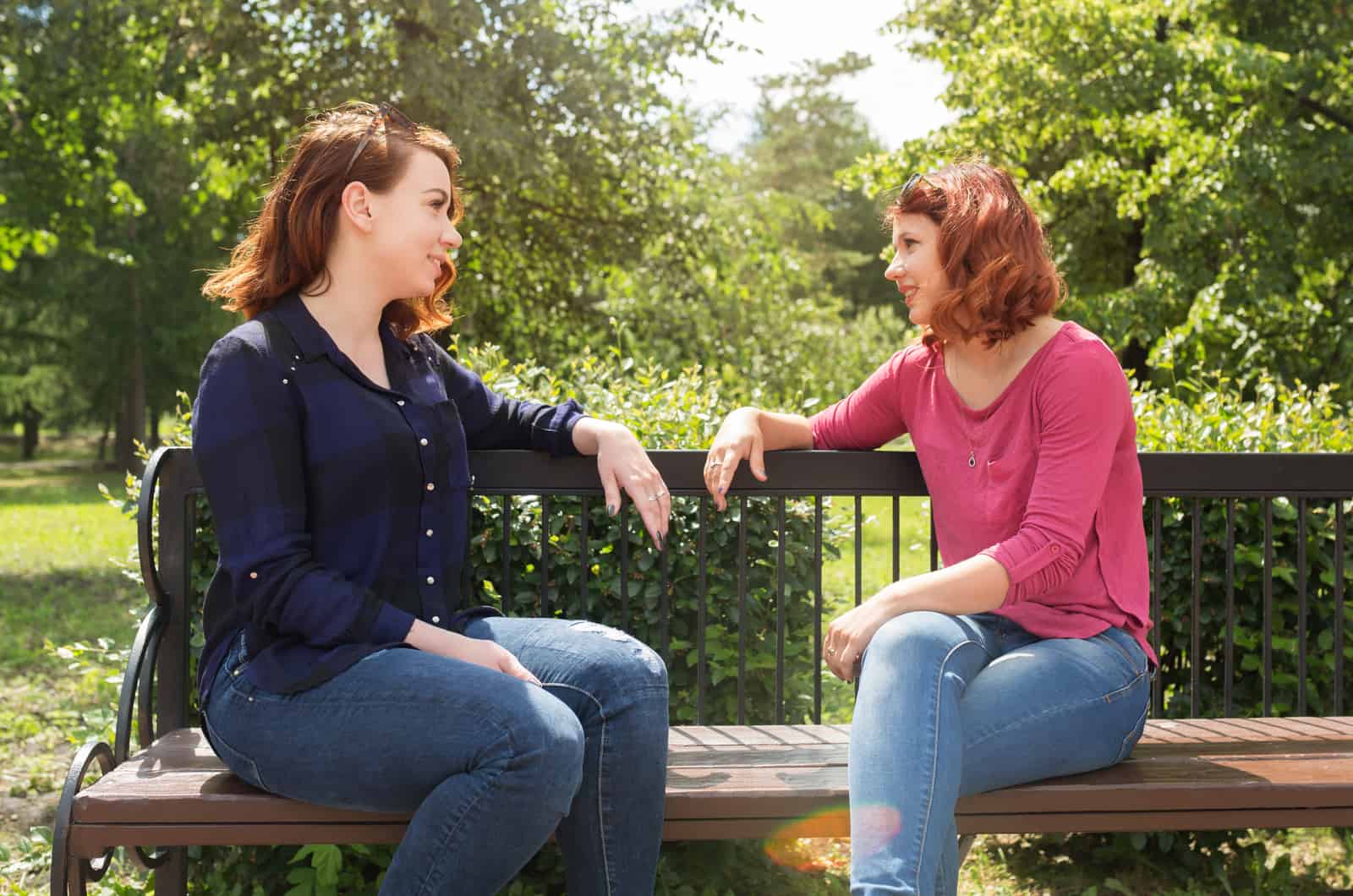 two girls talking in park