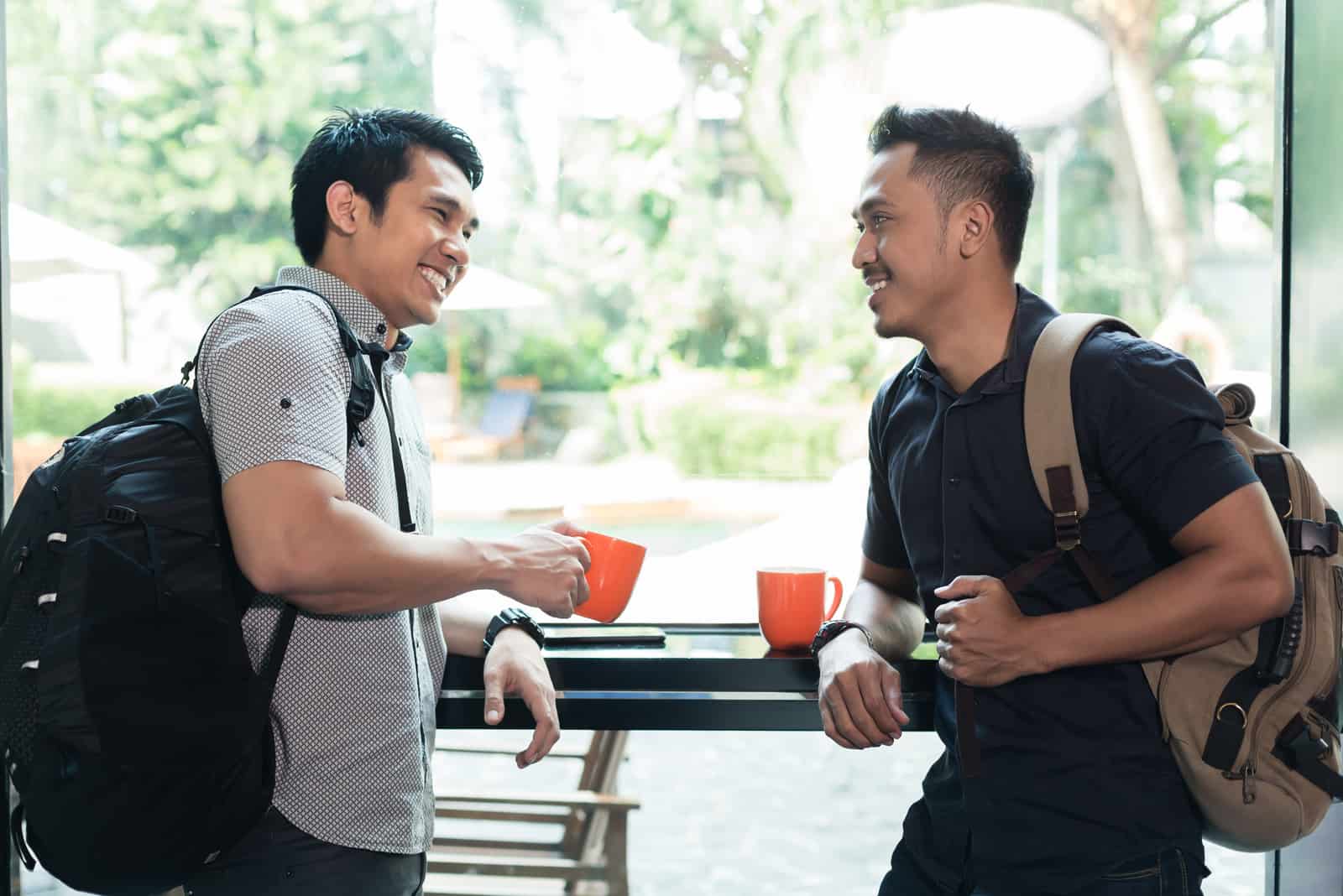 two guys talking at cafe