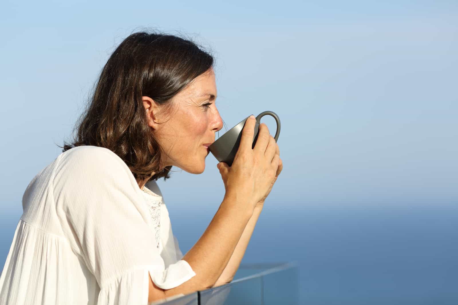woman drinking tea alone