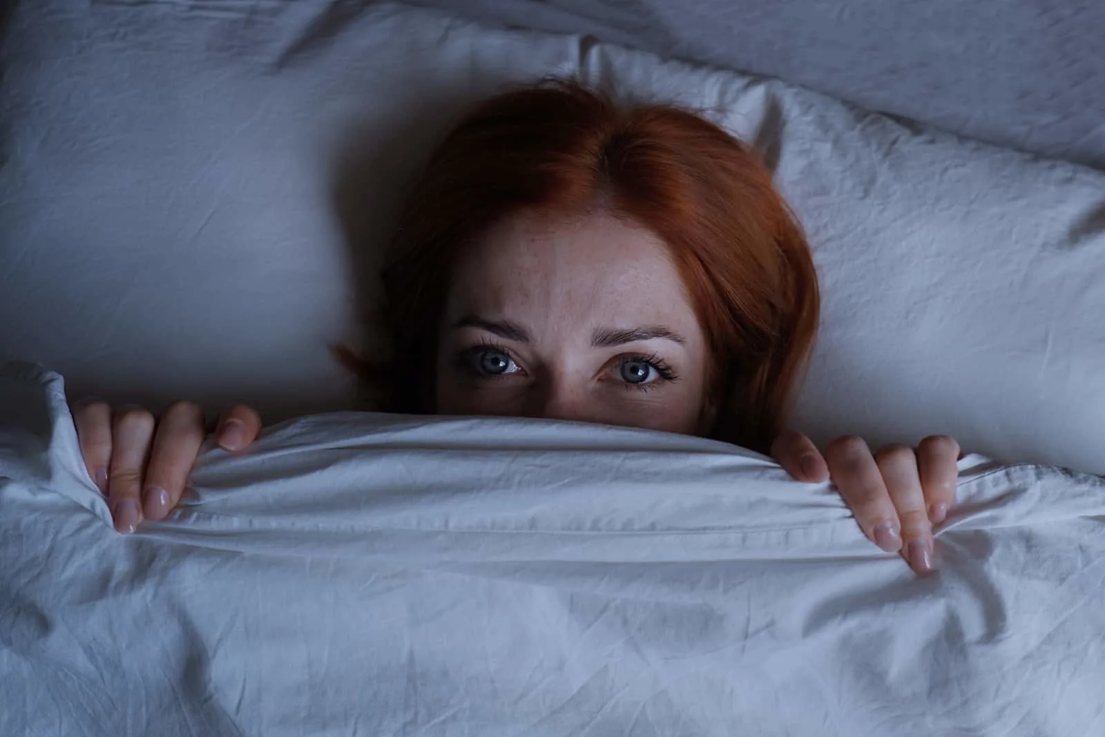 woman lying awake in bed