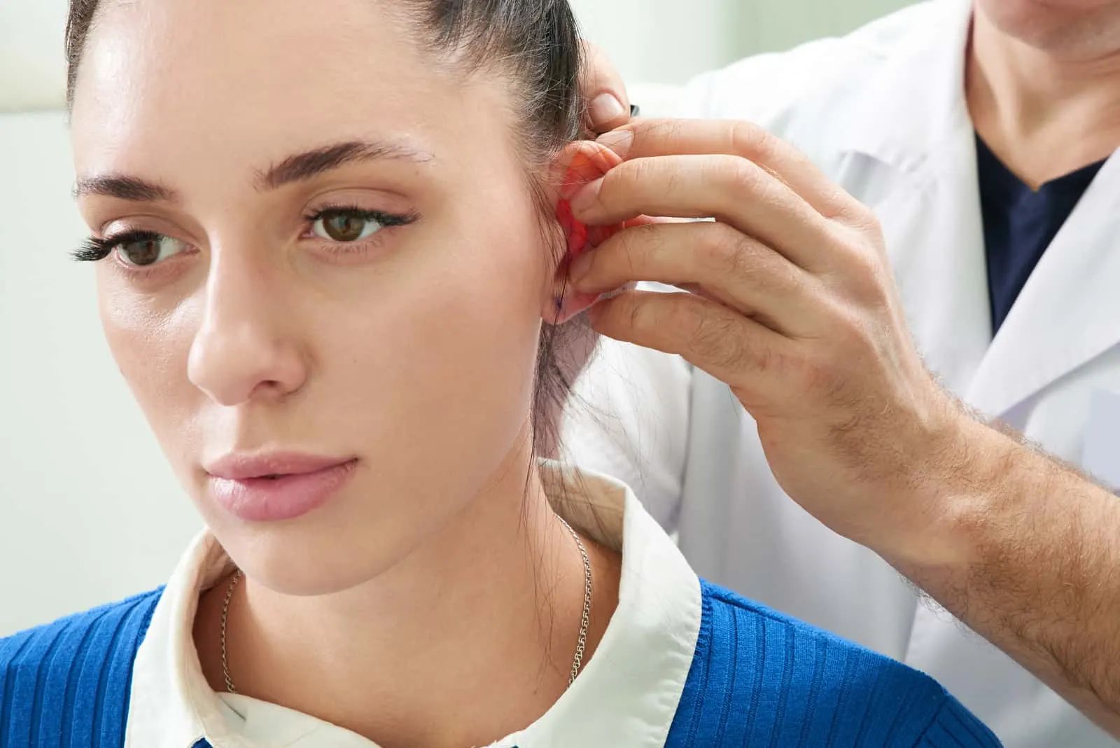 woman on ear examination