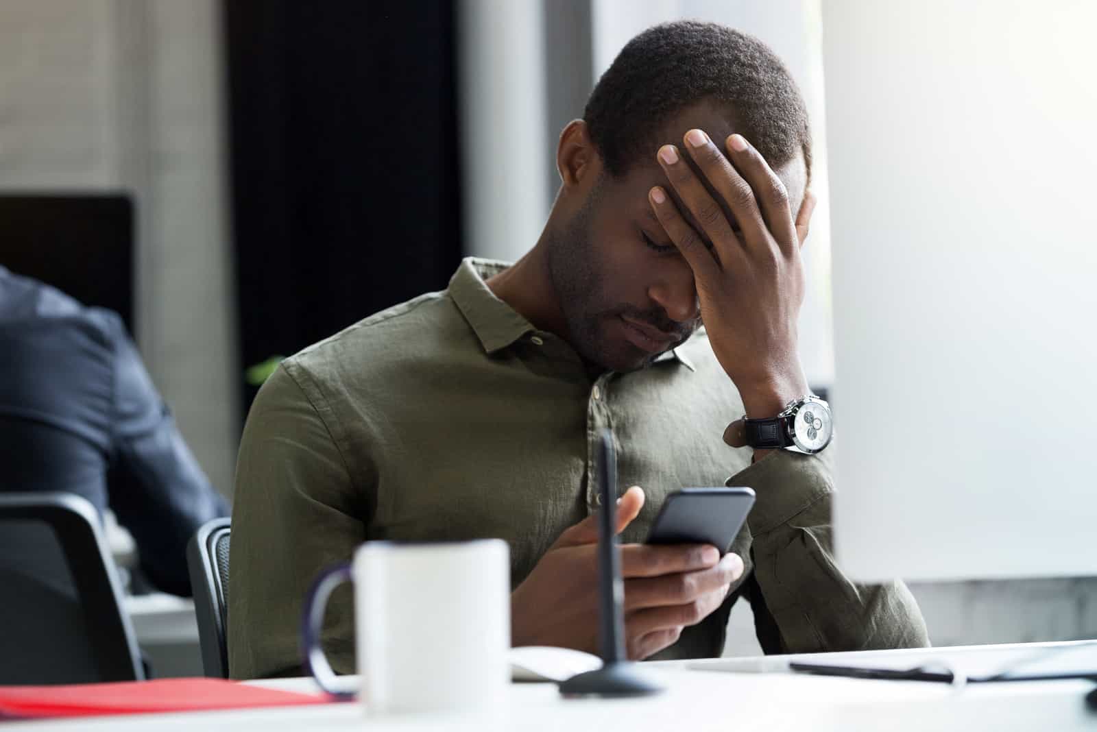 worried man reading his messages