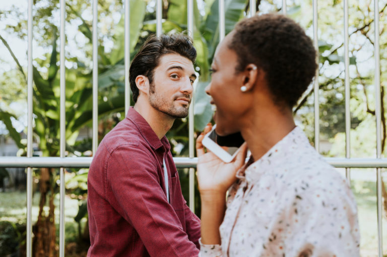 man staring at a woman walking by