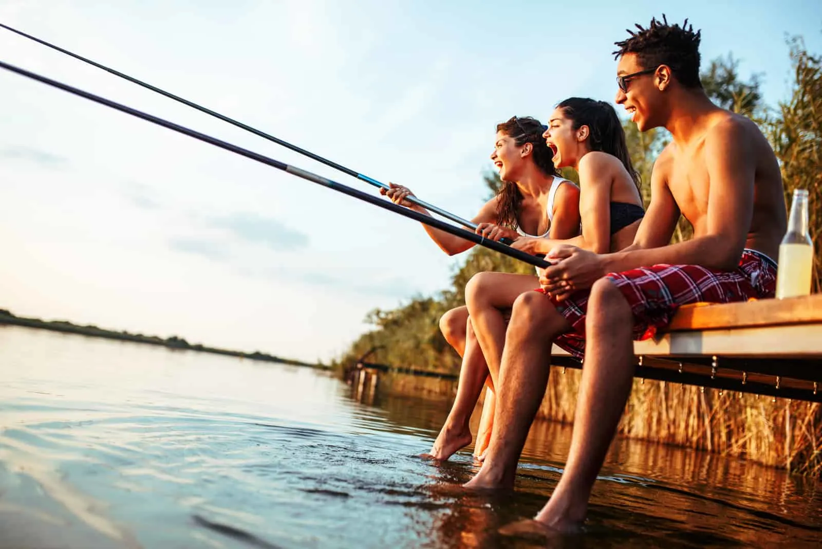 group of young friends fishing