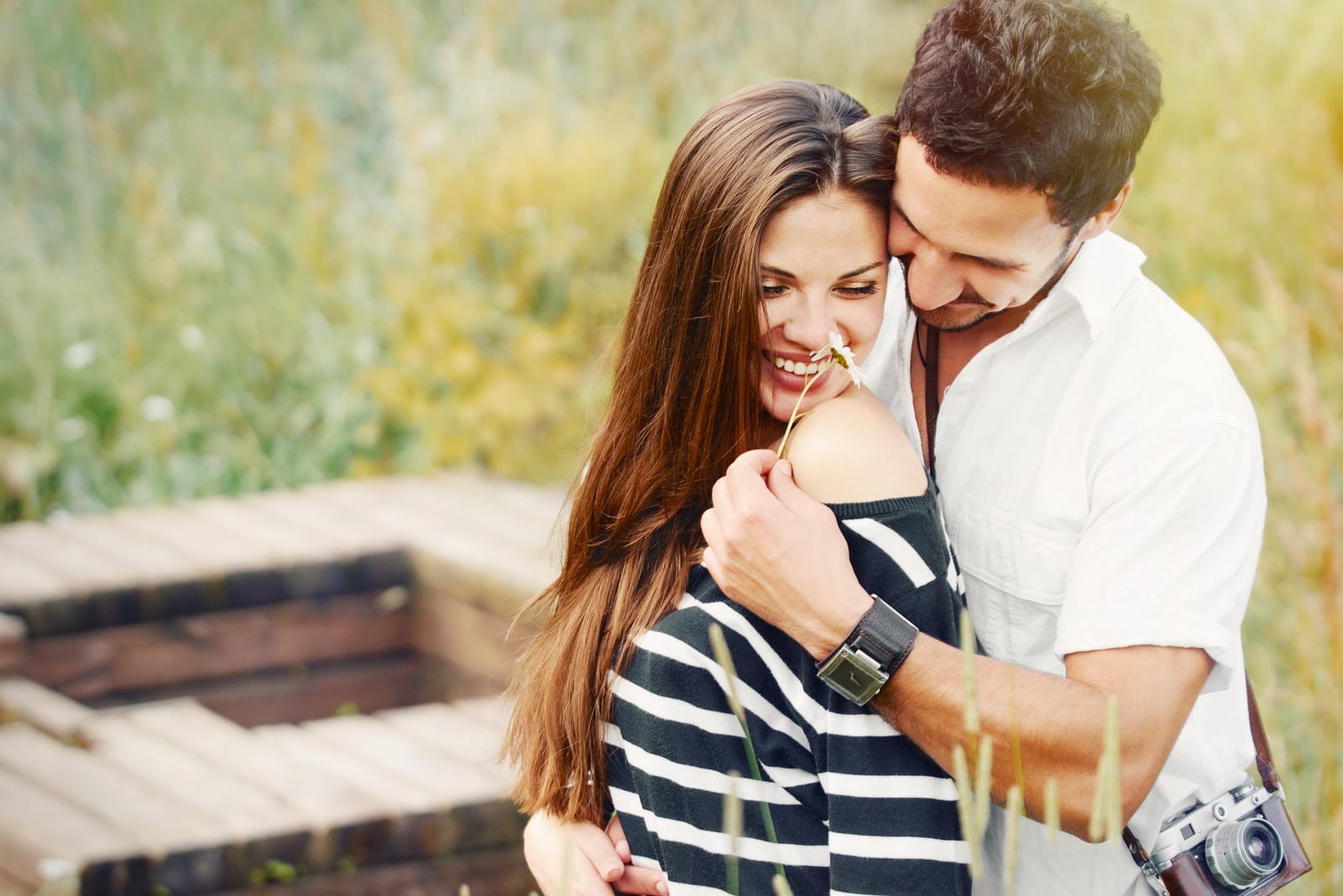 happy romantic couple in the field