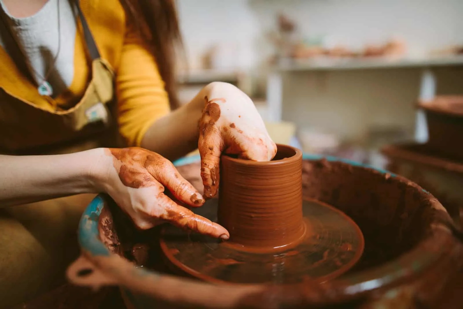 young woman doing pottery