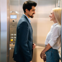 man and woman flirt in elevator