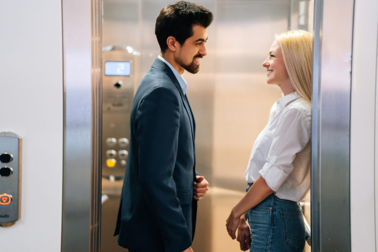man and woman flirt in elevator