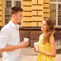 young man talking with beautiful woman outdoor