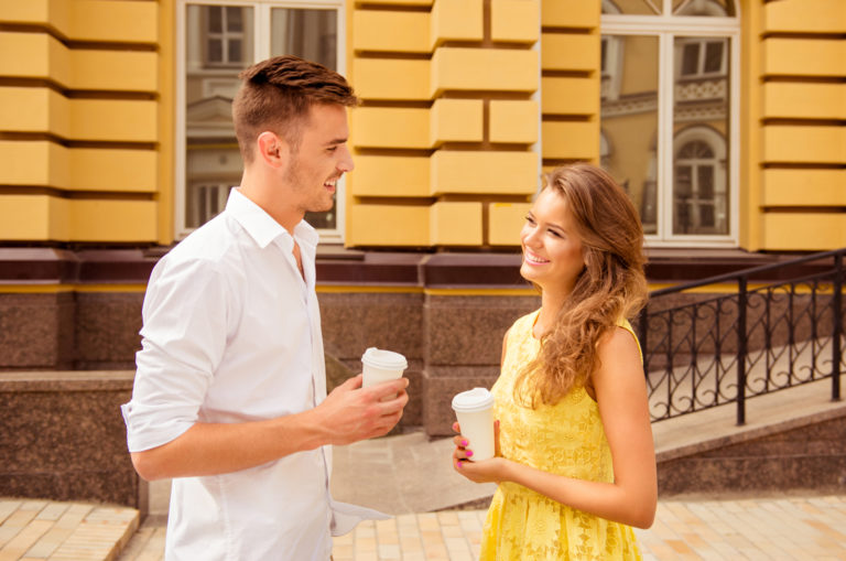 young man talking with beautiful woman outdoor
