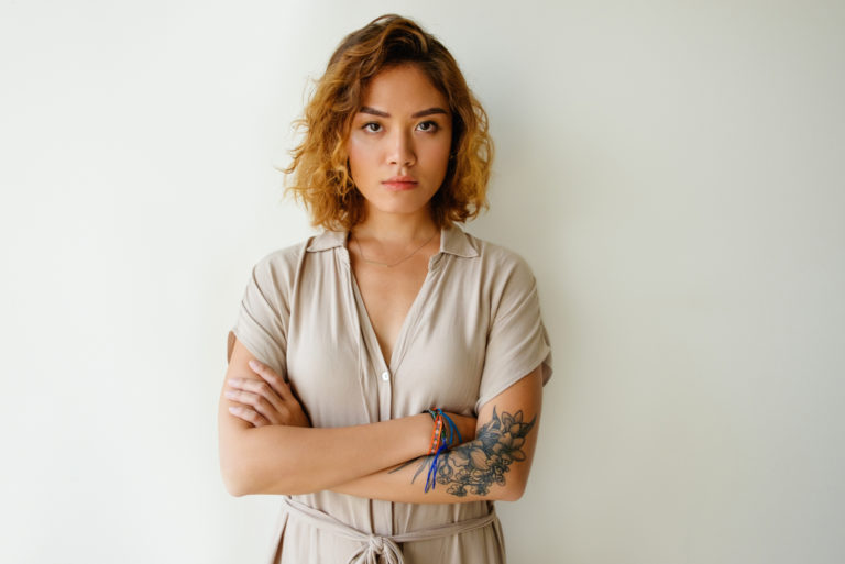 portrait of a serious woman with crossed arms