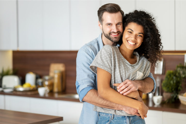 happy couple posing in hug
