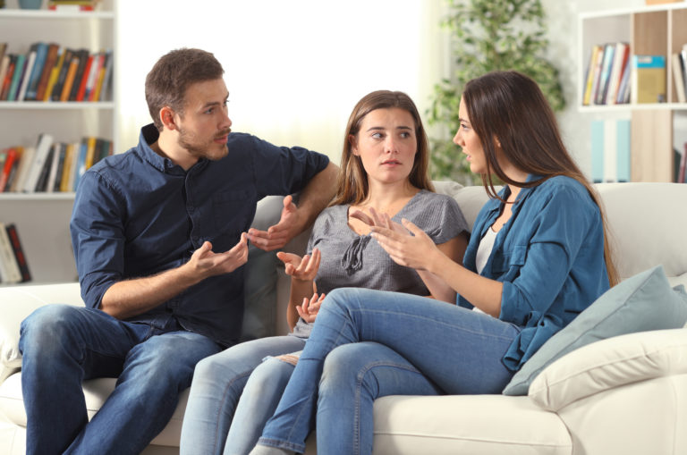 married couple talking with a friend