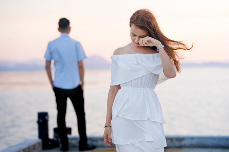 woman walking away after a break up