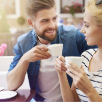 couple drinking coffee and talking
