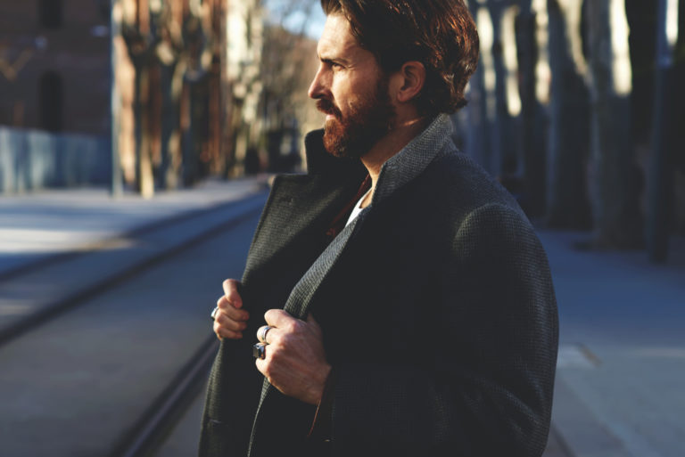 man standing on street