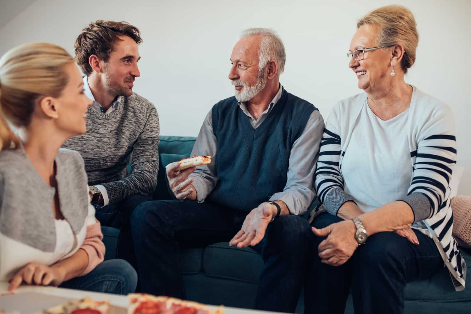 a man and a woman talking to their family