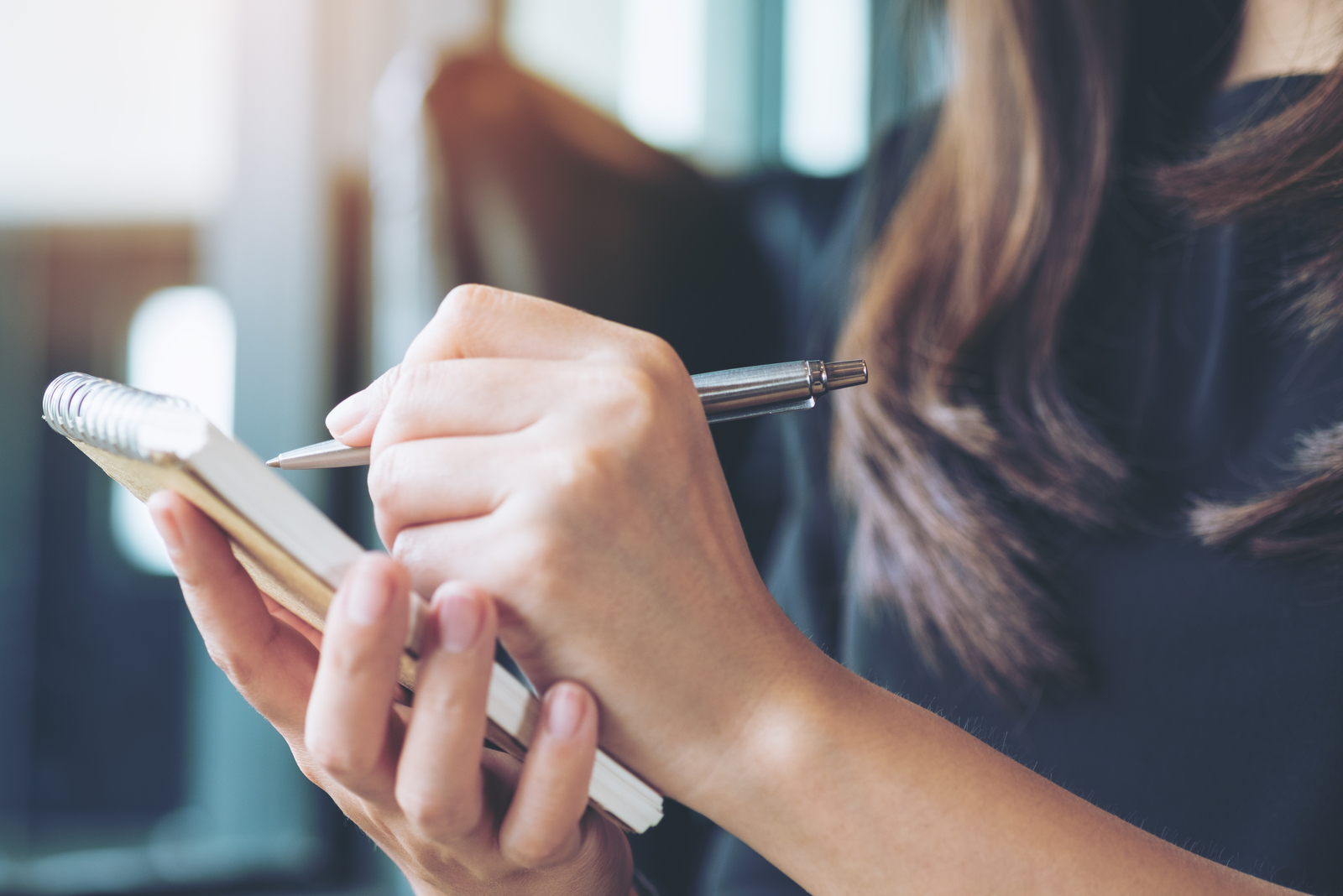 the woman sits and writes