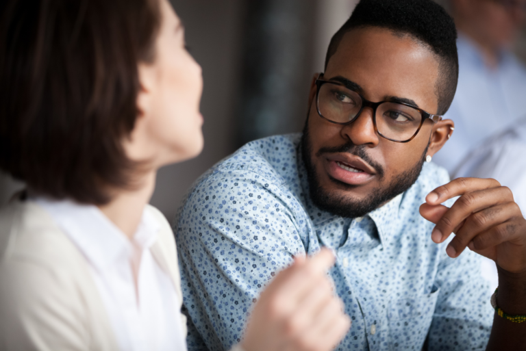 a man is talking to a woman