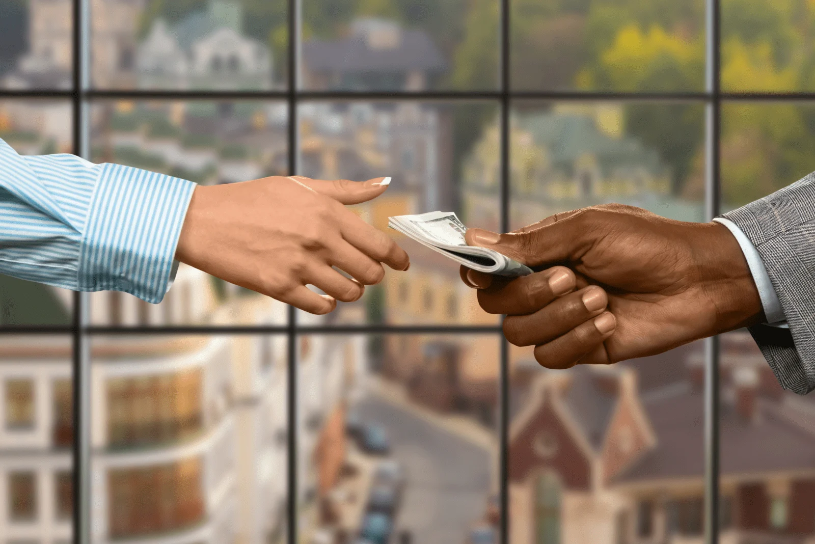 a woman takes money from a man's hand