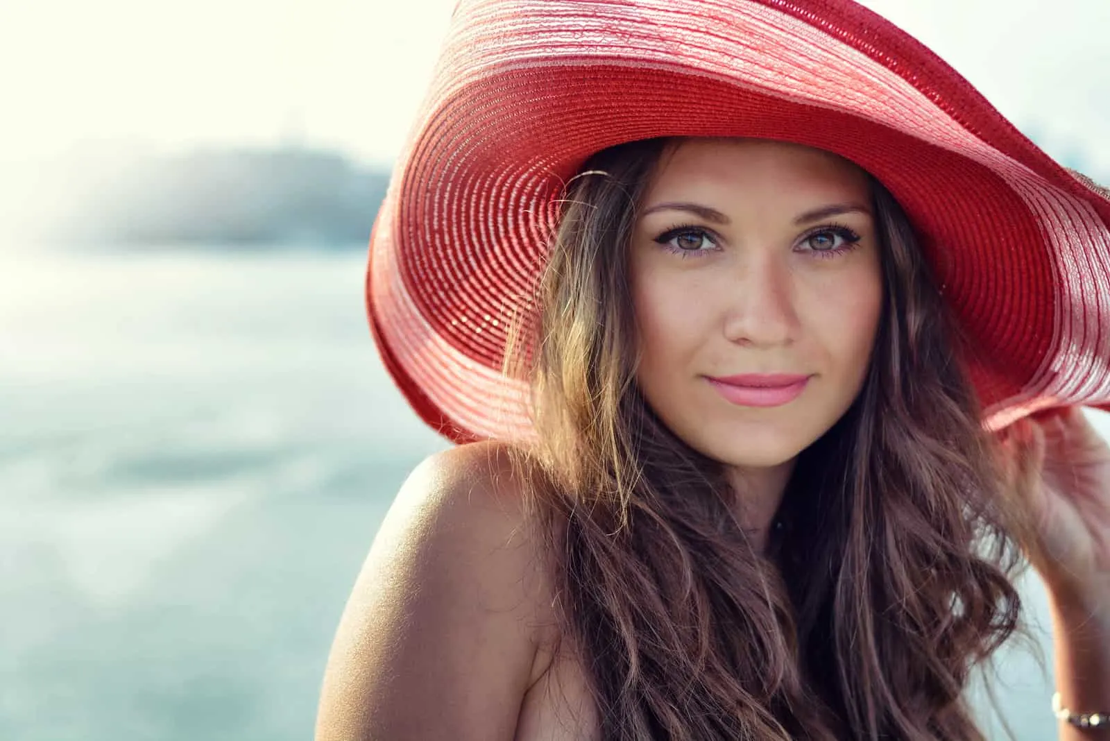 attractive woman posing with hat