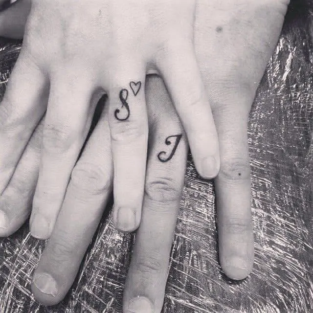 name initials tattoo on ring fingers for couples  EntertainmentMesh