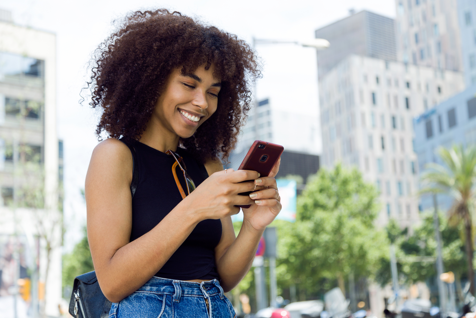 woman standing outside and thinking about snapchat caption