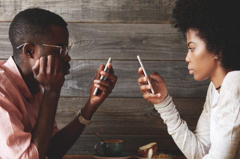 couple looking at their phones