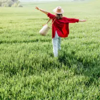 woman crossing a field