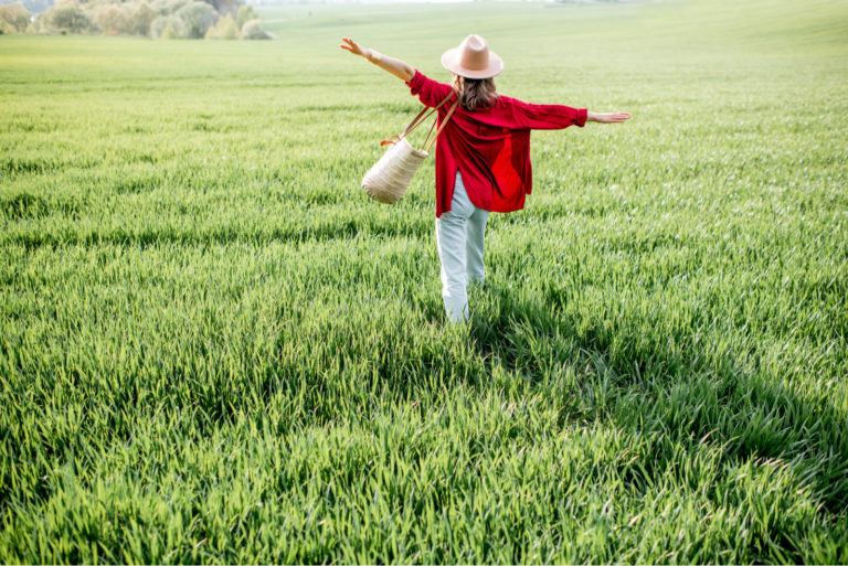 woman crossing a field