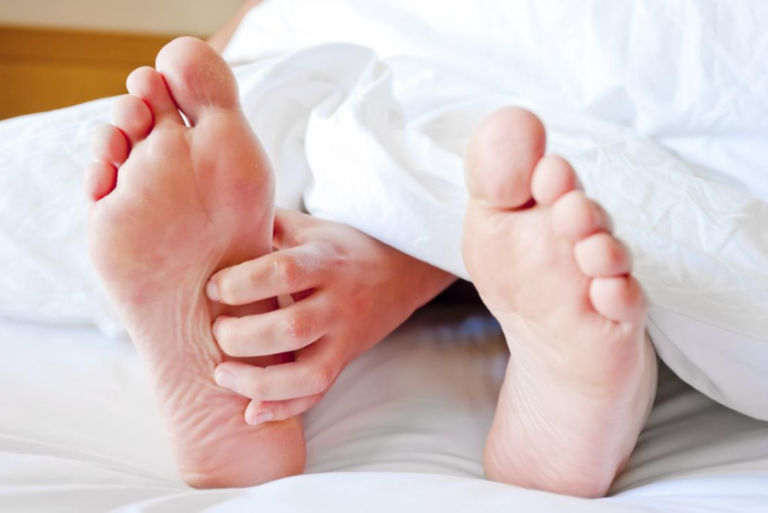 woman's right foot itches