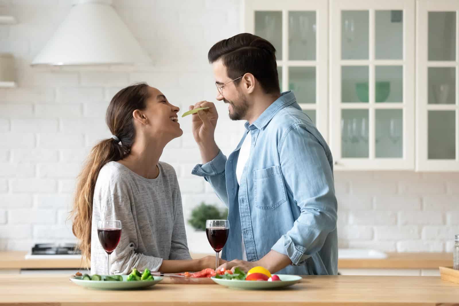 couple prepare food in apartment