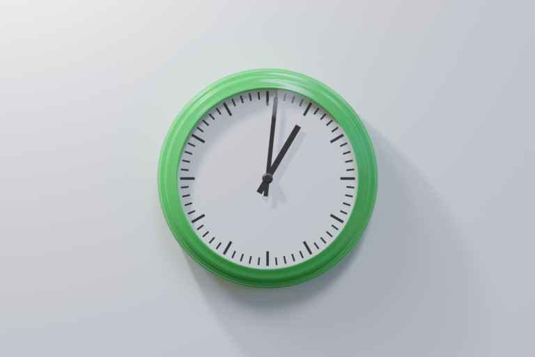green clock on a white wall