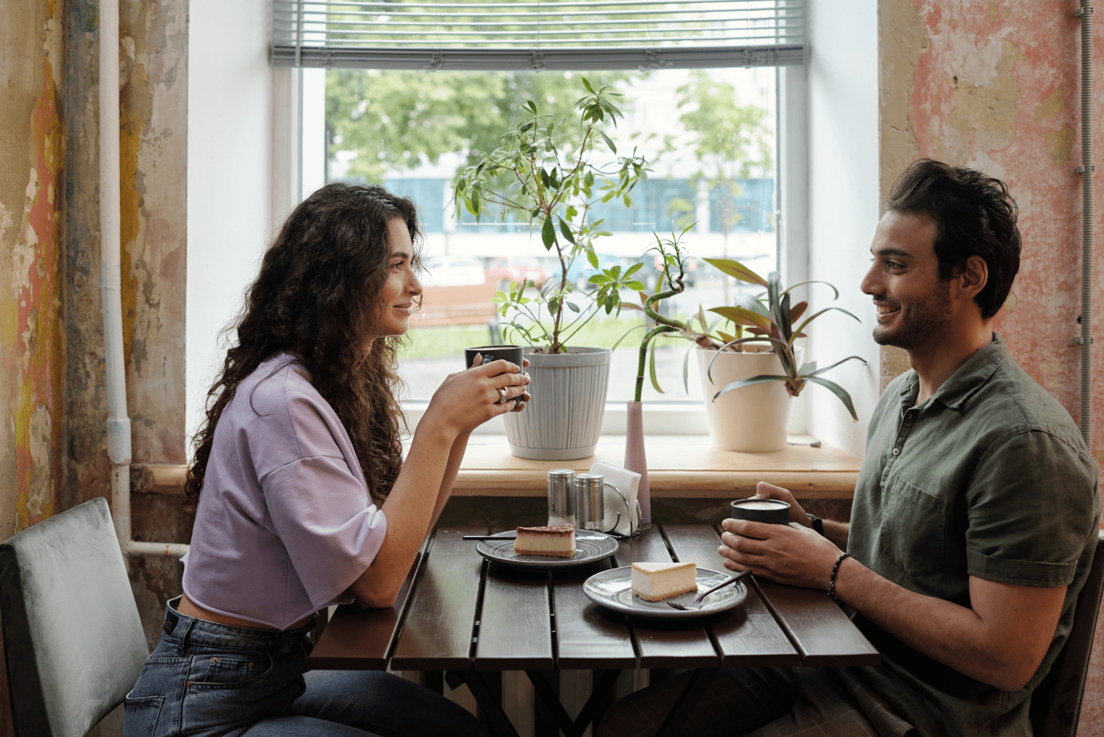a smiling woman sits with a man