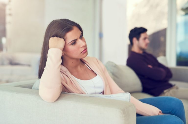 young woman giving her husband the silent treatment