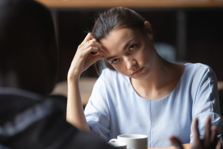 fed up woman looking at man