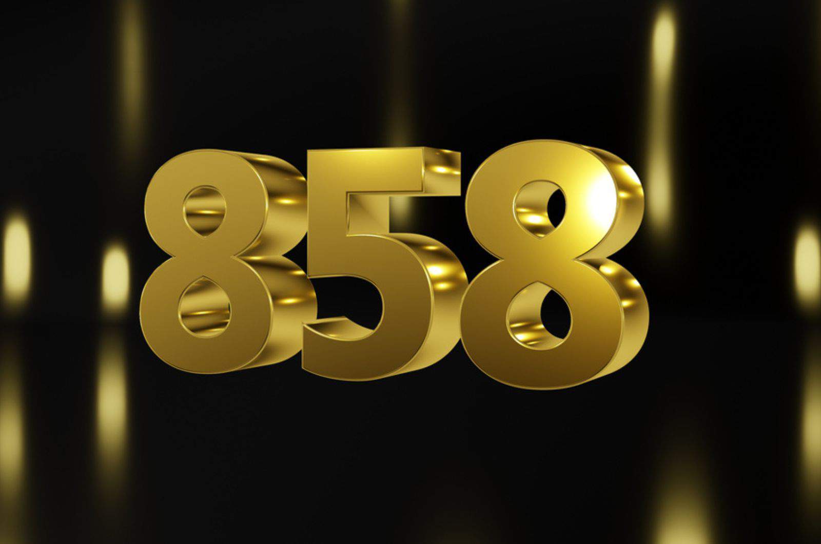 Number 858 in gold on black and gold background