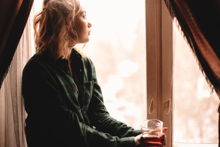 woman sitting by window