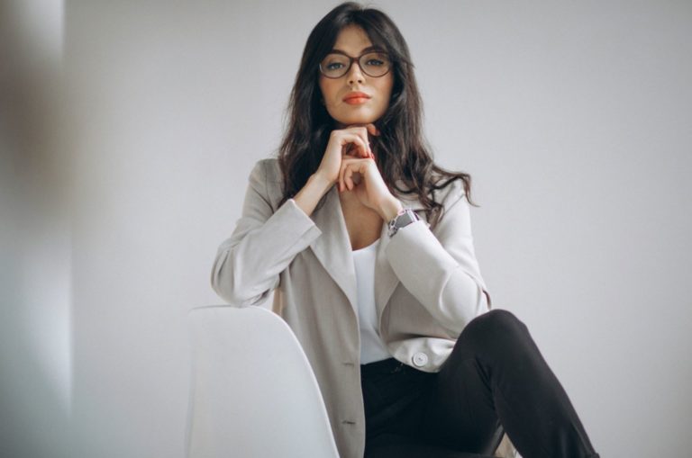 serious woman posing on the chair