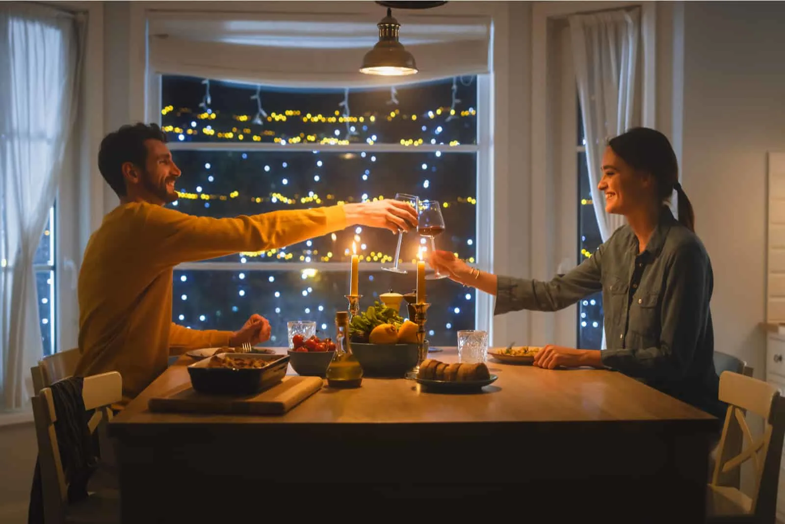 couple having dinner in an apartment