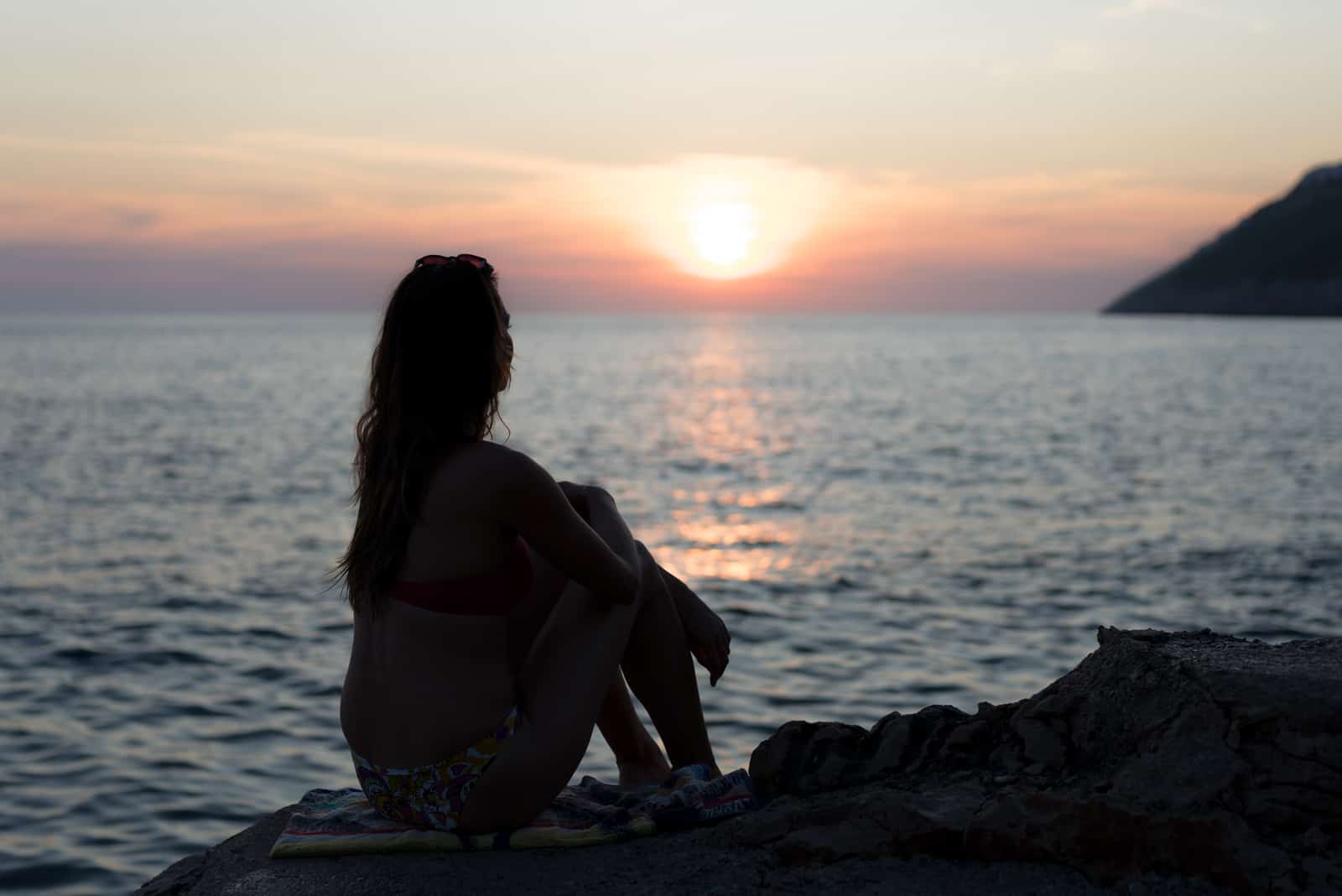 woman watching sunset