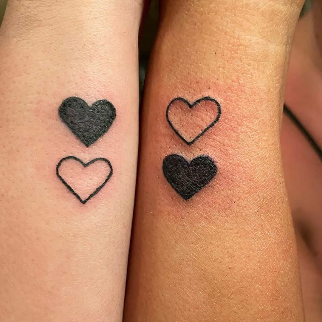 Black & white hearts matching best friends tattoo