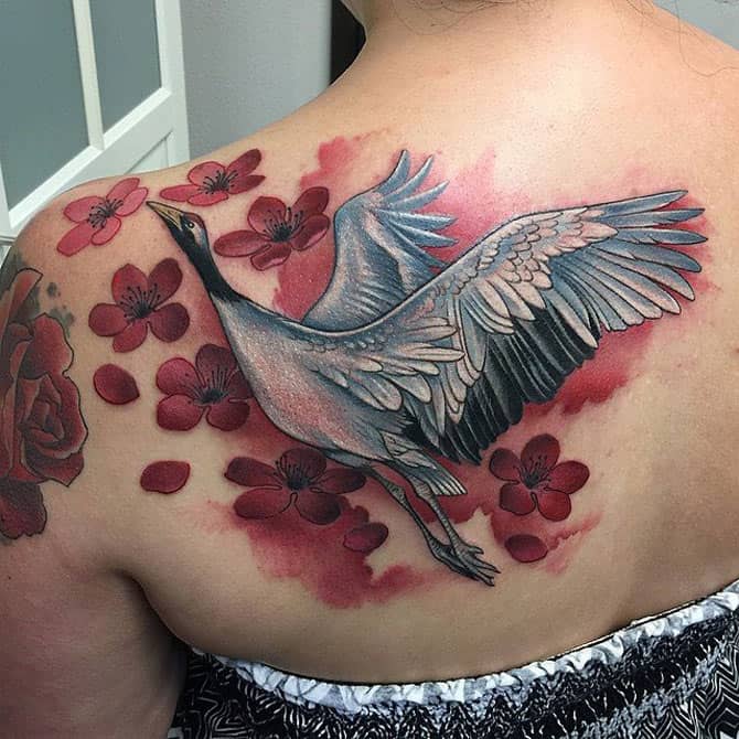 Crane and flowers tattoo